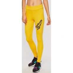 Reebok Classic - Legginsy. Żółte spodnie damskie Reebok Classic, s, z nadrukiem, z elastanu. W wyprzedaży za 149,90 zł.