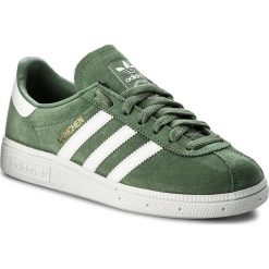 Buty adidas - Munchen CQ2323 Tragrn/Ftwwht/Goldmt. Zielone buty sportowe damskie Adidas, na co dzień, bez wzorów, z zamszu, klasyczne, bez obcasa, na płaskiej podeszwie, bez zapięcia. W wyprzedaży za 299,00 zł.
