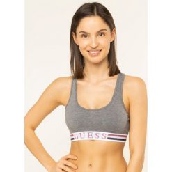 Biustonosz top Guess O01C12 JR003. Czarne biustonosze Guess, z aplikacjami, z elastanu. W wyprzedaży za 89,00 zł.