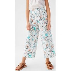Mango Kids - Spodnie dziecięce Rosa 110-164 cm. Białe spodnie dziewczęce Mango Kids, bez wzorów, z bawełny. Za 99,90 zł.