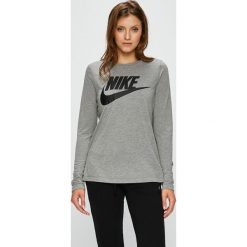 Nike Sportswear - Bluzka. Szare topy damskie Nike Sportswear, s, z nadrukiem, z poliesteru, z okrągłym kołnierzem. W wyprzedaży za 89,90 zł.