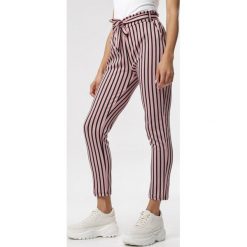 Różowe Spodnie Oaralin. Różowe jeansy damskie Born2be, xl, z tkaniny, z podwyższonym stanem. Za 59,99 zł.