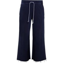Bryczesy damskie: Mother LOUNGE ROLLER CROP FRAY Spodnie treningowe navy