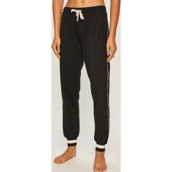 Dkny - Spodnie. Niebieskie spodnie damskie DKNY, s, z elastanu. W wyprzedaży za 249,90 zł.