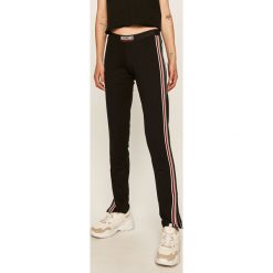 Moschino Underwear - Legginsy. Czarne spodnie damskie Moschino Underwear, s, z aplikacjami, z elastanu. W wyprzedaży za 449,90 zł.