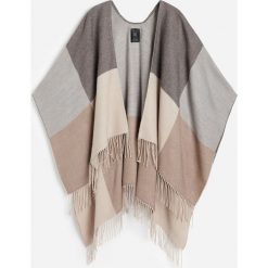 Ponczo w kratę -. Poncza damskie Reserved, bez wzorów. Za 79,99 zł.