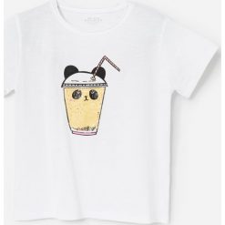 T-shirt z brokatową aplikacją -. T-shirty damskie Reserved, z aplikacjami, bez kołnierzyka. W wyprzedaży za 15,99 zł.