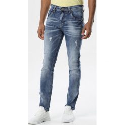 Niebieskie Jeansy Hyrah. Niebieskie jeansy męskie Born2be, m, bez wzorów, eleganckie, długie. Za 79,99 zł.