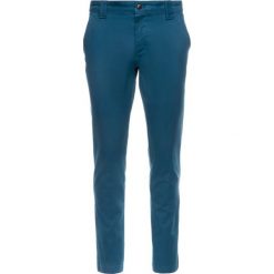 Spodnie materiałowe Tommy Jeans DM0DM06518. Zielone jeansy męskie Tommy Jeans, m, bez wzorów, z elastanu. W wyprzedaży za 209,00 zł.