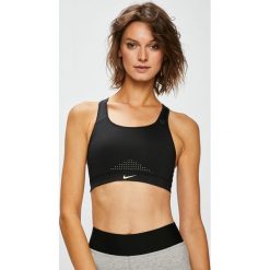 Nike - Biustonosz. Różowe biustonosze sportowe Nike, z dzianiny. W wyprzedaży za 159,90 zł.