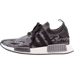 Adidas Originals NMD_R1 PK Tenisówki i Trampki core black/grey three. Czarne trampki męskie marki adidas Originals, z tworzywa sztucznego. W wyprzedaży za 561,75 zł.