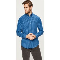 Izod - Koszula. Niebieskie koszule męskie IZOD, s, bez wzorów, z bawełny, casualowe, button down, z długim rękawem. W wyprzedaży za 89,90 zł.