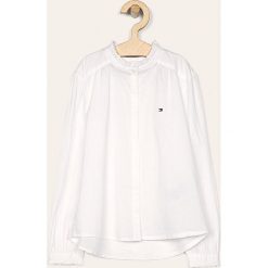 Tommy Hilfiger - Koszula dziecięca 128-176 cm. Białe bluzki dziewczęce TOMMY HILFIGER, bez wzorów, z bawełny, ze stójką, z długim rękawem, długie, bez kaptura. Za 269,90 zł.