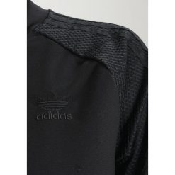 Adidas Originals TRACK Bluza rozpinana black. Szare bluzy damskie marki adidas Originals, na co dzień, z nadrukiem, z bawełny, casualowe, z okrągłym kołnierzem, proste. Za 349,00 zł.
