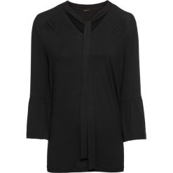 Długi shirt z falbanami bonprix czarny. Czarne koszulki damskie marki bonprix, bez wzorów, eleganckie, bez kołnierzyka, z długim rękawem. Za 59,99 zł.