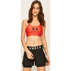 Under Armour - Biustonosz sportowy. Pomarańczowe biustonosze sportowe damskie Under Armour, xs, z nadrukiem, z elastanu. Za 129,90 zł.