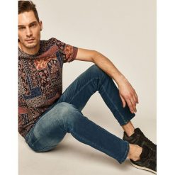 Medicine - Jeansy City Attitude. Niebieskie jeansy męskie MEDICINE, z aplikacjami. W wyprzedaży za 99,90 zł.