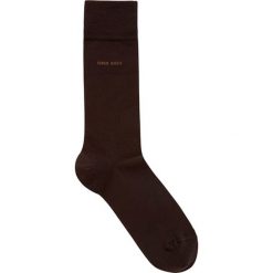 Skarpety w kolorze brązowym. Pomarańczowe skarpetki męskie HUGO BOSS, bez wzorów, z materiału. W wyprzedaży za 37,95 zł.