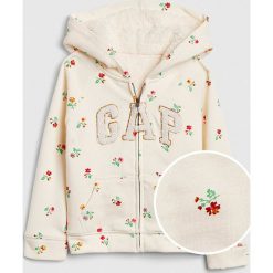 Bluza w kolorze białym. Białe bluzy niemowlęce Gap Kids, z aplikacjami, bez rękawów, bez kaptura. W wyprzedaży za 75,95 zł.
