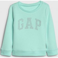 Bluza w kolorze turkusowym. Niebieskie bluzy niemowlęce Gap Kids, bez wzorów, bez rękawów, bez kaptura. W wyprzedaży za 37,95 zł.