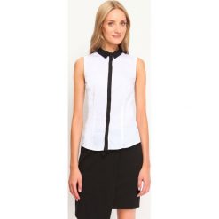 Bluzka bez rękawów luźna, klasyczna. Białe bluzki damskie Top Secret, bez wzorów, z tkaniny, eleganckie, z kontrastowym kołnierzykiem, bez rękawów. W wyprzedaży za 24,99 zł.