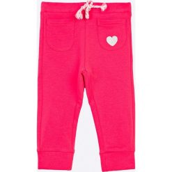 Blukids - Spodnie dziecięce 68-98 cm. Różowe spodnie dziewczęce Blukids, s, bez wzorów, z elastanu, casualowe. W wyprzedaży za 24,90 zł.