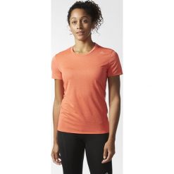 Koszulka adidas Supernova SS Tee W Koralowa. Pomarańczowe bluzki sportowe damskie marki Adidas, bez wzorów, bez kołnierzyka, z krótkim rękawem, krótkie, bez kaptura, do biegania. Za 89,99 zł.