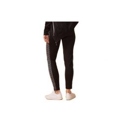 Legginsy damskie obcisłe. Brązowe legginsy skórzane TXM. Za 19,99 zł.