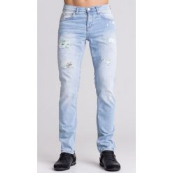 Niebieskie jeansy męskie z przetarciami i zielonymi wstawkami. Niebieskie jeansy męskie Versace Jeans, m, z aplikacjami. Za 375,60 zł.