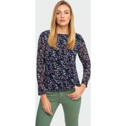 Elegancka bluzka. Bluzki damskie Greenpoint, bez wzorów, z poliesteru, eleganckie, bez kołnierzyka, bez rękawów. Za 89,99 zł.