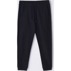 Dresowe spodnie ECO AWARE -. Spodnie męskie Cropp, s, bez wzorów, z dresówki. Za 69,99 zł.