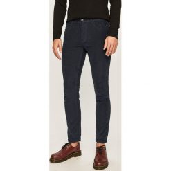 Produkt by Jack & Jones - Spodnie. Niebieskie spodnie męskie PRODUKT by Jack & Jones, na co dzień, bez wzorów, z bawełny, casualowe. W wyprzedaży za 89,90 zł.