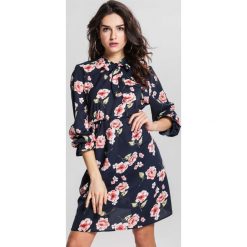 Granatowa Sukienka Begonia. Niebieskie sukienki damskie other, na co dzień, xl, bez wzorów, sportowe, bez kołnierzyka, bez rękawów, midi, rozkloszowane. Za 69,99 zł.