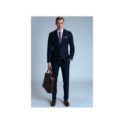 GARNITUR ADMIRAL. Niebieskie garnitury męskie marki Guns&tuxedos, bez wzorów. Za 499,99 zł.