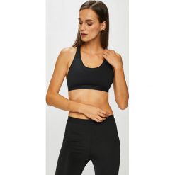 Calvin Klein Performance - Biustonosz. Czarne biustonosze sportowe damskie Calvin Klein Performance, xs, bez wzorów, z elastanu. W wyprzedaży za 99,90 zł.