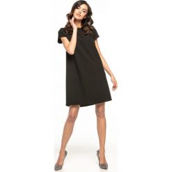 Sukienka trapezowa elegancka czarna - 36. Czarne sukienki damskie e-margeritka.pl, s, bez wzorów, z poliesteru, eleganckie, z długim rękawem, długie, bez kaptura. Za 138,99 zł.