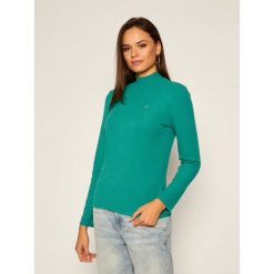 Bluzka Tommy Jeans Rib Mock Neck DW0DW09105. Różowe bluzki damskie Tommy Jeans, m, bez wzorów, z jeansu, bez kołnierzyka, bez rękawów. Za 229,00 zł.