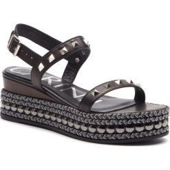Espadryle CARINII - B4832 E50-000-000-A87. Czarne espadryle damskie Carinii, bez wzorów, ze skóry, bez obcasa, na obcasie. W wyprzedaży za 269,00 zł.