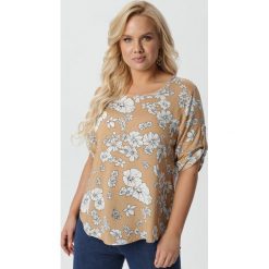 Beżowa Bluzka Pherophonos. Brązowe bluzki damskie Born2be, xl, z aplikacjami, z jeansu, z okrągłym kołnierzem, plus size, z krótkim rękawem. Za 59,99 zł.