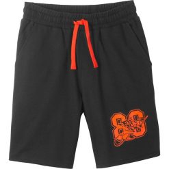 Bermudy dresowe bonprix czarno-neonowy pomarańczowy. Czarne dresy chłopięce bonprix, bez wzorów, z dresówki. Za 37,99 zł.