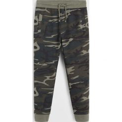 Mango Kids - Spodnie dziecięce Fossil 110-164 cm. Niebieskie spodnie chłopięce Mango Kids, bez wzorów, z bawełny, casualowe. Za 69,90 zł.