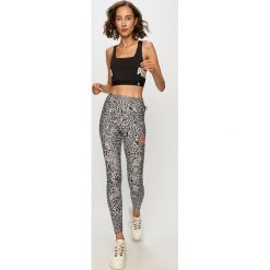 Puma - Legginsy x Mr Doodle. Czarne spodnie damskie Puma, s, bez wzorów, z elastanu. Za 289,90 zł.