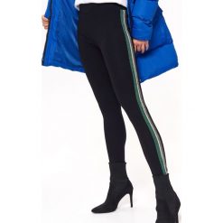 Legginsy damskie, z brokatową taśmą. Czarne legginsy damskie TROLL, s. Za 89,99 zł.