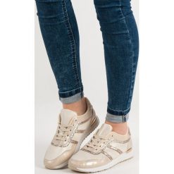 BUTY SPORTOWE Z BROKATEM. Żółte buty sportowe damskie Merg, bez wzorów, bez zapięcia. Za 69,90 zł.