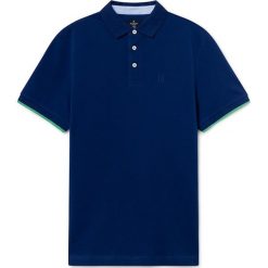 Koszulka polo w kolorze ciemnoniebieskim. Niebieskie koszulki męskie Hackett London, m, bez wzorów, z bawełny, polo, bez rękawów. W wyprzedaży za 199,95 zł.