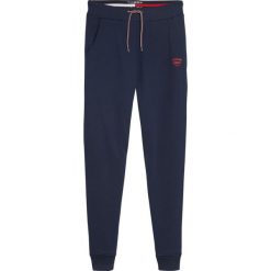 Spodnie dresowe Tommy Jeans Logo DW0DW08071. Szare spodnie damskie Tommy Jeans, xl, z jeansu. W wyprzedaży za 269,00 zł.