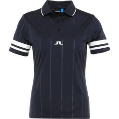 J.LINDEBERG FEBE Koszulka polo navy. Niebieskie koszulki damskie polo marki J.LINDEBERG, xs, bez wzorów, z poliesteru, polo, bez rękawów, bez kaptura. Za 379,00 zł.