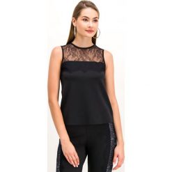 Top TwinSet 192LI2WDD. Czarne bluzki damskie Twinset, xs, bez wzorów, z elastanu, polo, bez rękawów. W wyprzedaży za 209,00 zł.