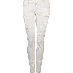 Guess Jeansy "Skinny Ultra Low". Jeansy damskie Guess, z aplikacjami, z jeansu, z obniżonym stanem. Za 319,00 zł.