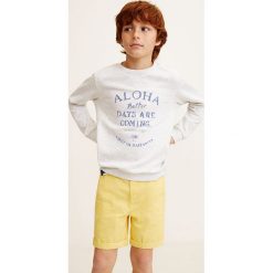 Mango Kids - Szorty dziecięce Pico4 104-164 cm. Żółte spodenki chłopięce Mango Kids, w paski, z bawełny, casualowe. W wyprzedaży za 39,90 zł.